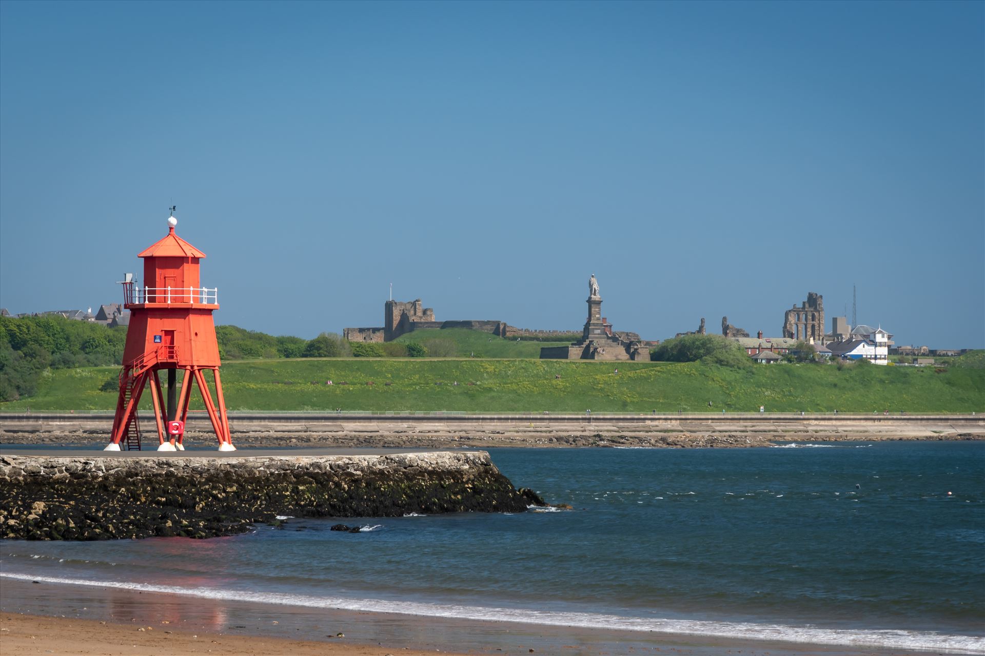 Herd Groyne Lighthouse, South Shields - Built 1882 from corrugated iron painted red.  On the gallery a fog bell sounds every 10 seconds. If on course show white, too far left shows red and too far right shows green. by Graham Dobson Photography